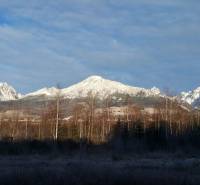 Snow-capped peaks of the High Tatras near Veľký Slavkov on Horný Slávkov Street.
