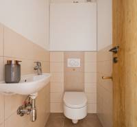A small bathroom in a 2-room apartment with a toilet and a sink.