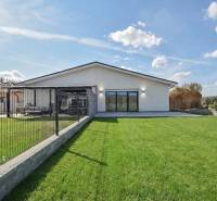 A family house in Beleža on Belža Street with a landscaped garden, fencing, and a terrace.