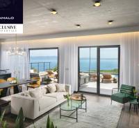 The villa with a wooden decor floor offers a cozy space with a sea view.