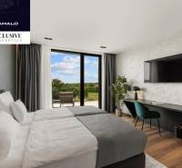 Stylish bedroom in a villa with large windows, a view, and a wooden decor floor.