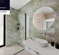 Bathroom with a sink, shower, and mirror in the villa.