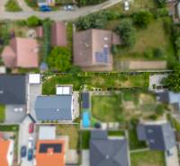 Aerial view of a family house on Školská Street in Láb with a well-maintained garden.