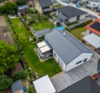 Family house on Školská Street 872/8 in Láb with a landscaped garden and lawn.