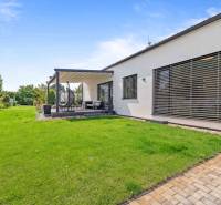 Family house on Školská Street 872/8 in Láb with a terrace and a well-maintained garden.
