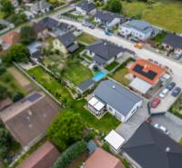 Family house on Školská Street 872/8 in Láb with a landscaped garden and surroundings.