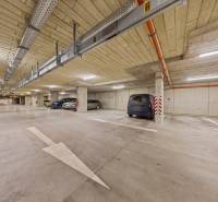 Underground parking on Rudroffova Street in Bratislava-Rača with several parked cars.