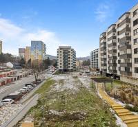 View of apartment buildings and parking spaces on Rudroffova Street in Bratislava - Rača.