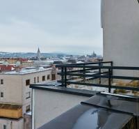 View of the roofs of Košice from the balcony of an apartment building on Strojárenská Street.