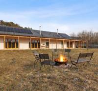 A building on Láb Street in Láb with a terrace and a fire pit in the yard.