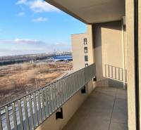 A balcony with a view of the surroundings of Bratislava - Devínska Nová Ves on Mateja Encingera Street.