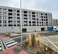 A modern six-story building on Mateja Encingera Street in Devínska Nová Ves, Bratislava.