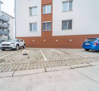 Parking spaces at the apartment building on Slavomírova Street in Slovenský Grob.
