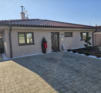 A family house on M. Terézie Street in Holíč with a neatly maintained front garden.