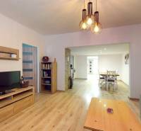 Living room of a family house with a wooden decor floor and furniture.