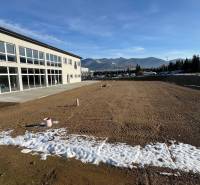 Commercial premises in Strečno on SNP Street with mountains in the background.