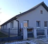 A family house in Žitavce on Žitavce Street with a front fence and a winter garden.