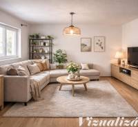 Living room in a family house with a comfortable sofa, decorations, and a wooden-patterned floor.