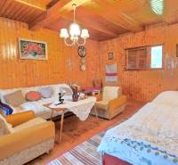 Wooden walls, furniture, and decorations in the interior of the family house create a cozy atmosphere.