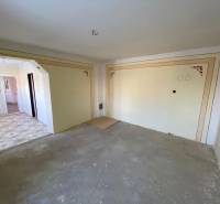 In a family house with white doors and decorative walls.