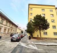 Cukrová Street in Bratislava - Old Town with cars, buildings, and a tree.