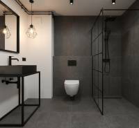 A bathroom in a family house with dark tiles and a sink on a black frame.