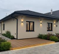 A family house in Veselé on Veselé street with a wooden decor floor and flower beds.