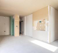 An anticipated 3-room apartment with unfinished walls and a light floor with a wooden decor.