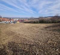Land for residential use in Banka on Poľná Street with a view of the surrounding houses.
