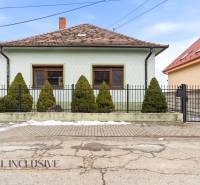 A family house on Čečínska Potôň in Orechová Potôň with a fence and a garden.