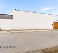 A family house in Dolný Štál with a modern facade and a wooden garage door.