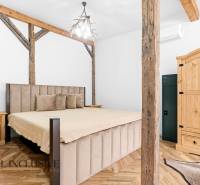 A bedroom in a family house with wooden decor and rustic elements.