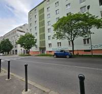 Mýtna Street, Bratislava - Staré Mesto, shows a row of apartment buildings and parked cars.