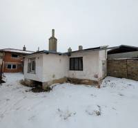A snowy yard at an older family house on Remeselnícka Street in Ľubica.