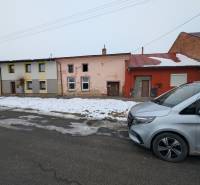 Family houses on Remeselnícka Street in Ľubica during the winter season with a snow cover.