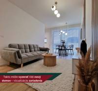 Living room with wood-patterned flooring, a sofa, and a dining table in a 3-room apartment.