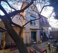 A family house on Štúrova Street in Piešťany with a yard and trees in the background.