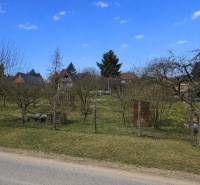 Gardens in Osuské on Opendáky with fruit trees and country cottages.