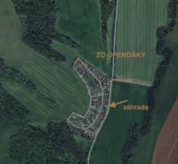 Aerial view of gardens in Osuské on Opendáky Street, surrounded by fields and forests.