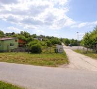 The landscape on Opendáky Street in Osuské shows gardens and a green house.