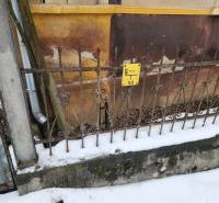 The fence of a family house in Felsőtelekes, covered with snow and with a gas sign.