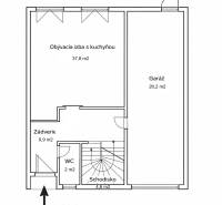 Ground floor plan of a family house with a staircase, garage, and living room with kitchen.