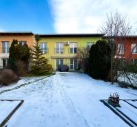 A two-story family house on Hrabová Street in Hamuliakovo with a snow-covered garden.