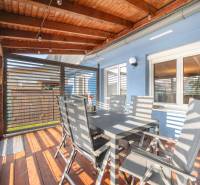 A terrace with a wooden ceiling and floor, dining in a family house on Južná Street, Miloslavov.