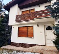 A family house on Fibichova Street in Bratislava - Ružinov with a wooden facade cladding.