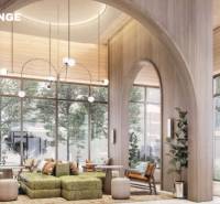 Modern lobby space with large arched windows and comfortable seating. Apartment construction.