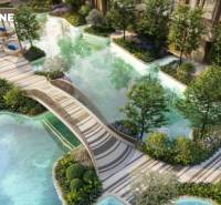 Apartment construction in Phuket: Garden with lagoon and bridge, landscaped greenery, water features.