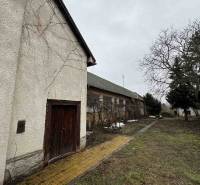 A family house on SNP Street in Šahy with an older exterior and a gravel pathway.