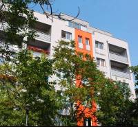 The building on Ovručská Street in Bratislava - Nové Mesto with balconies and greenery in the surroundings.