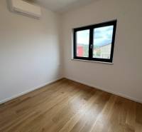 A room with wooden decor and air conditioning in a holiday apartment.